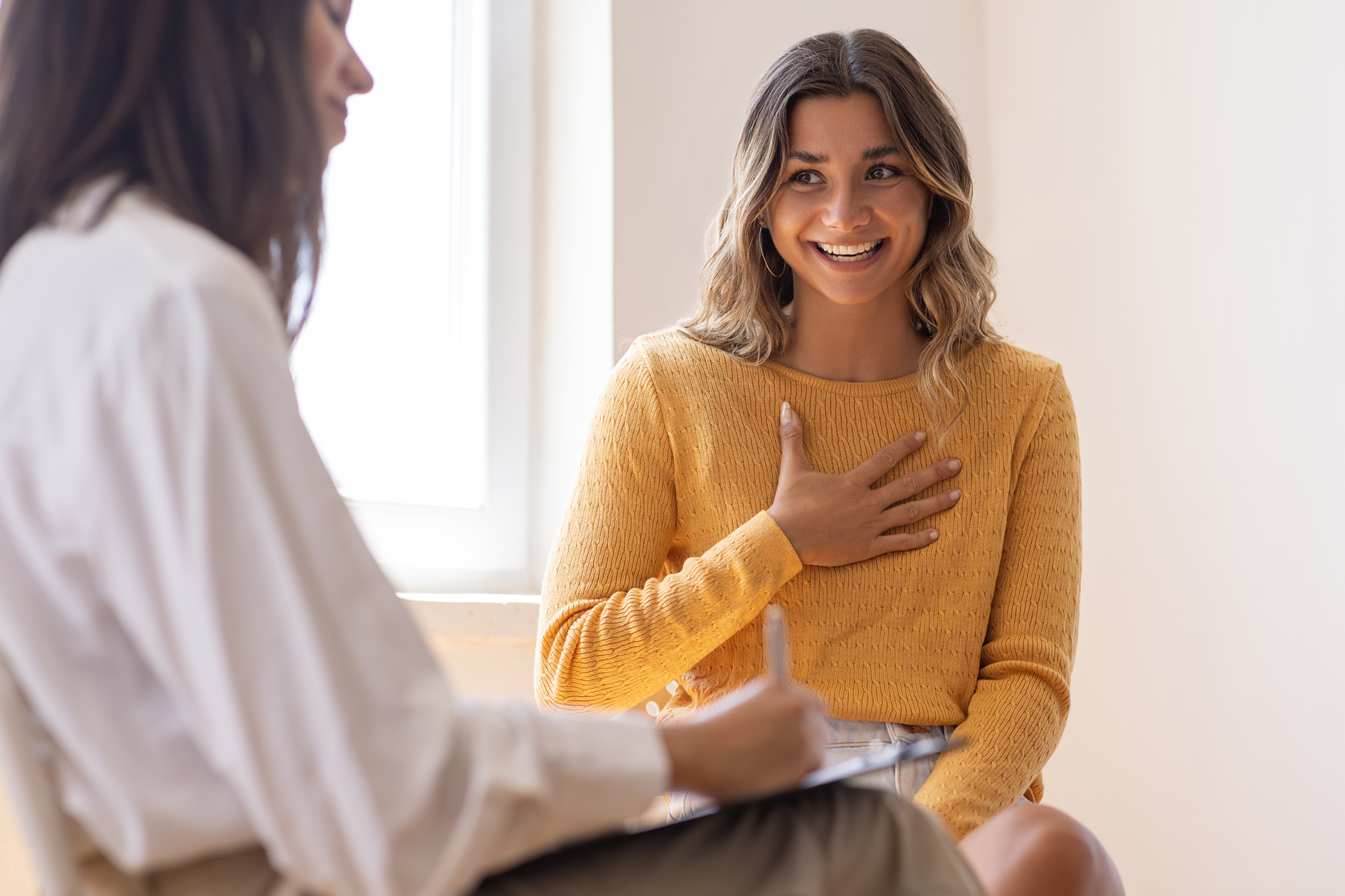 Patient shaking doctor's hand while doctor reassures him.