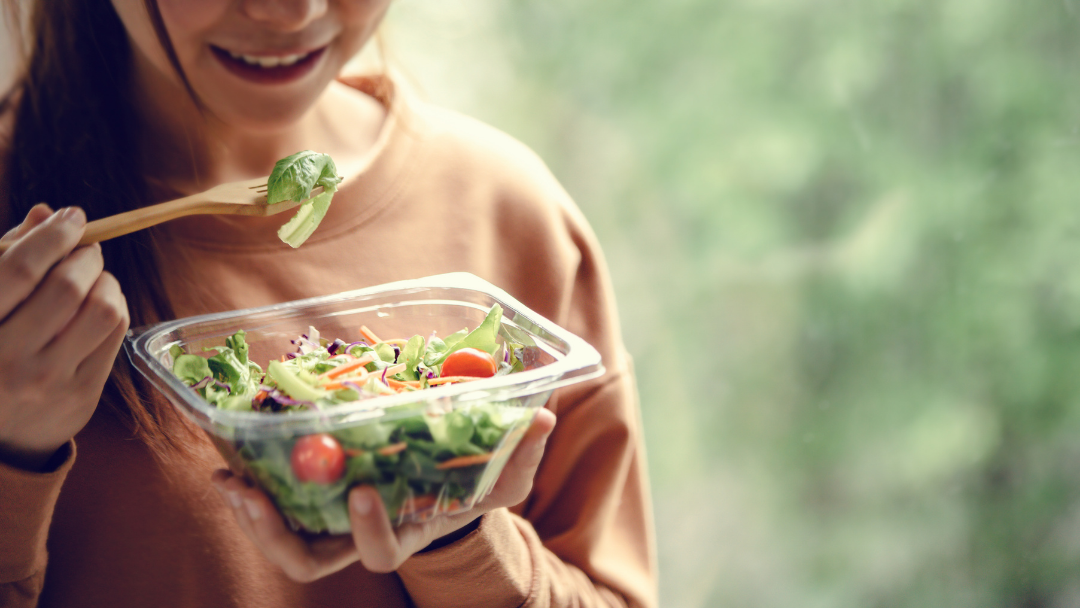 Someone Eating A Salad